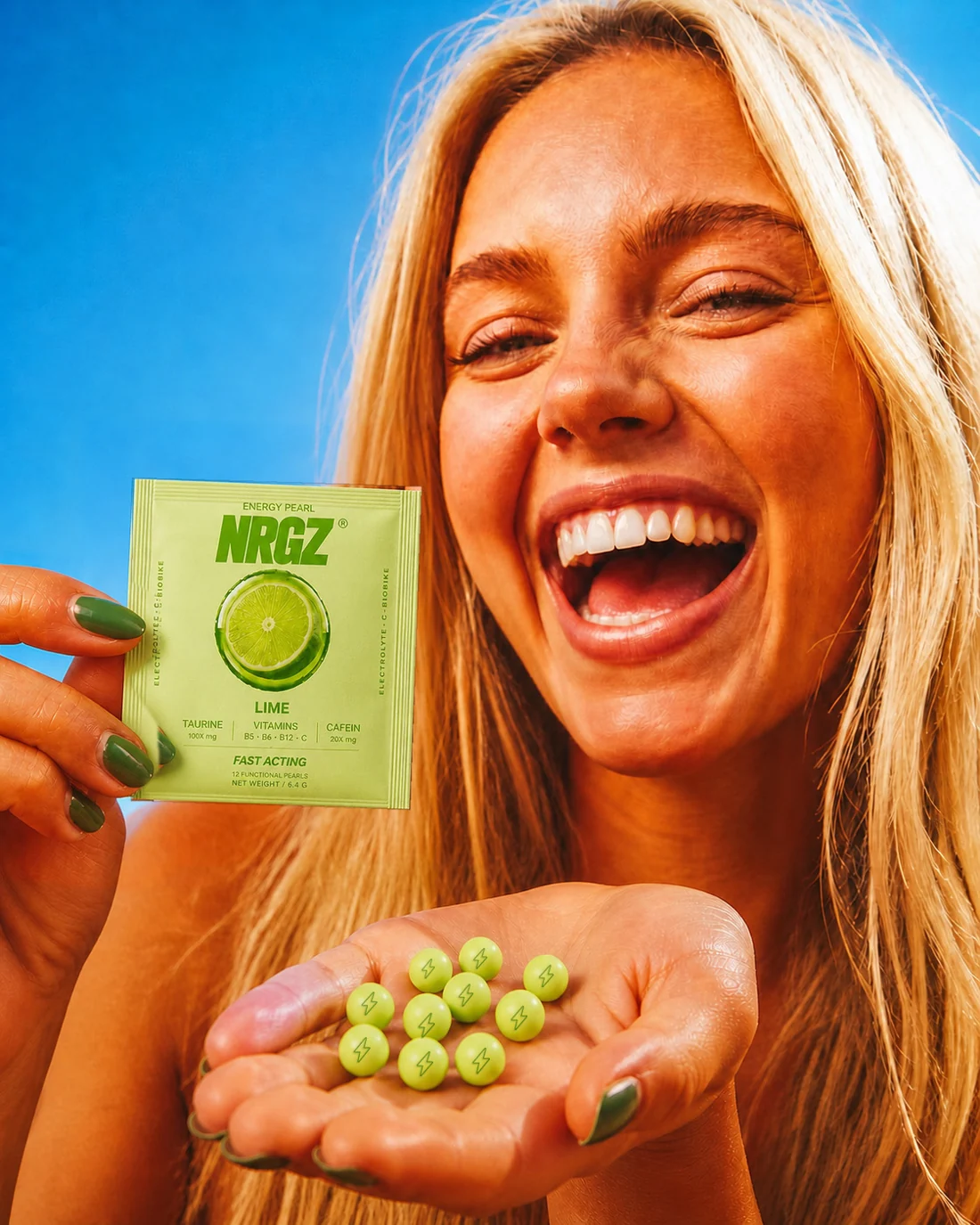 A woman holding a lime NRGZ pack and energy pearls